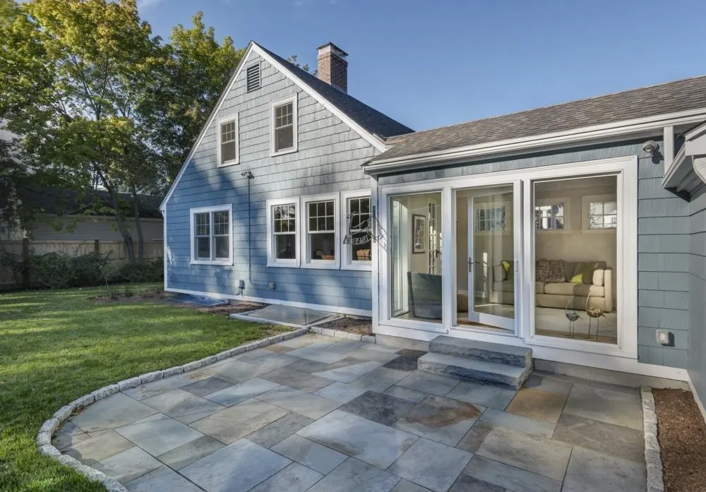 Completed home addition with expanded rear living space and garden connection by Lussoro Design + Build