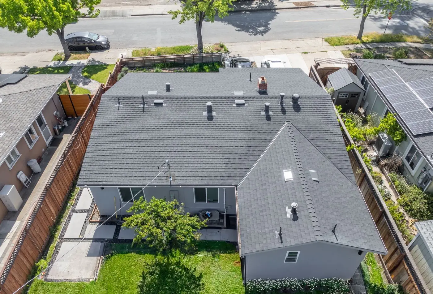 Aerial view of a completed rear home addition with matching roofline in San Mateo County
